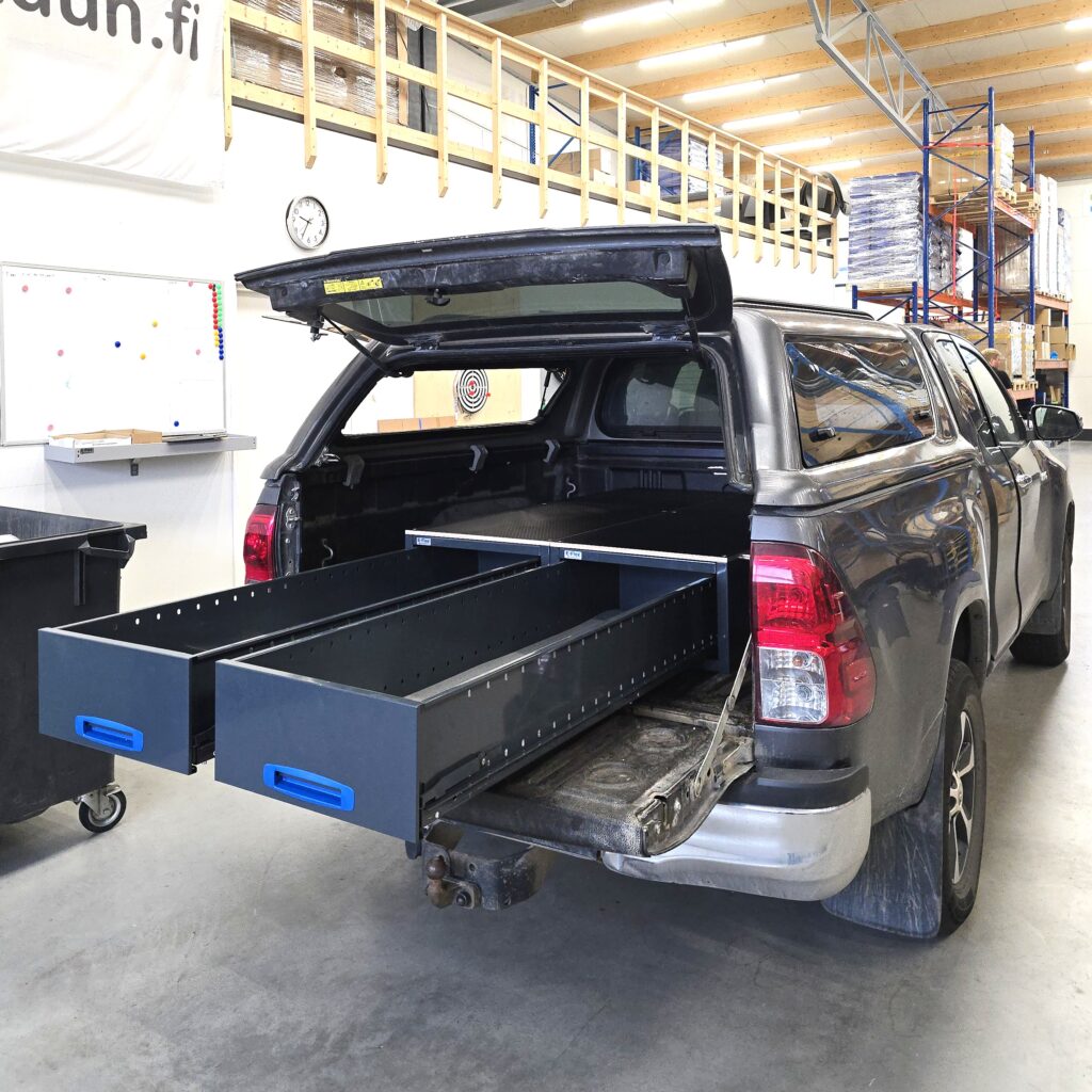 Toyota Hilux Extra Cab fitted with two 1521 mm long drawer units and plywood top