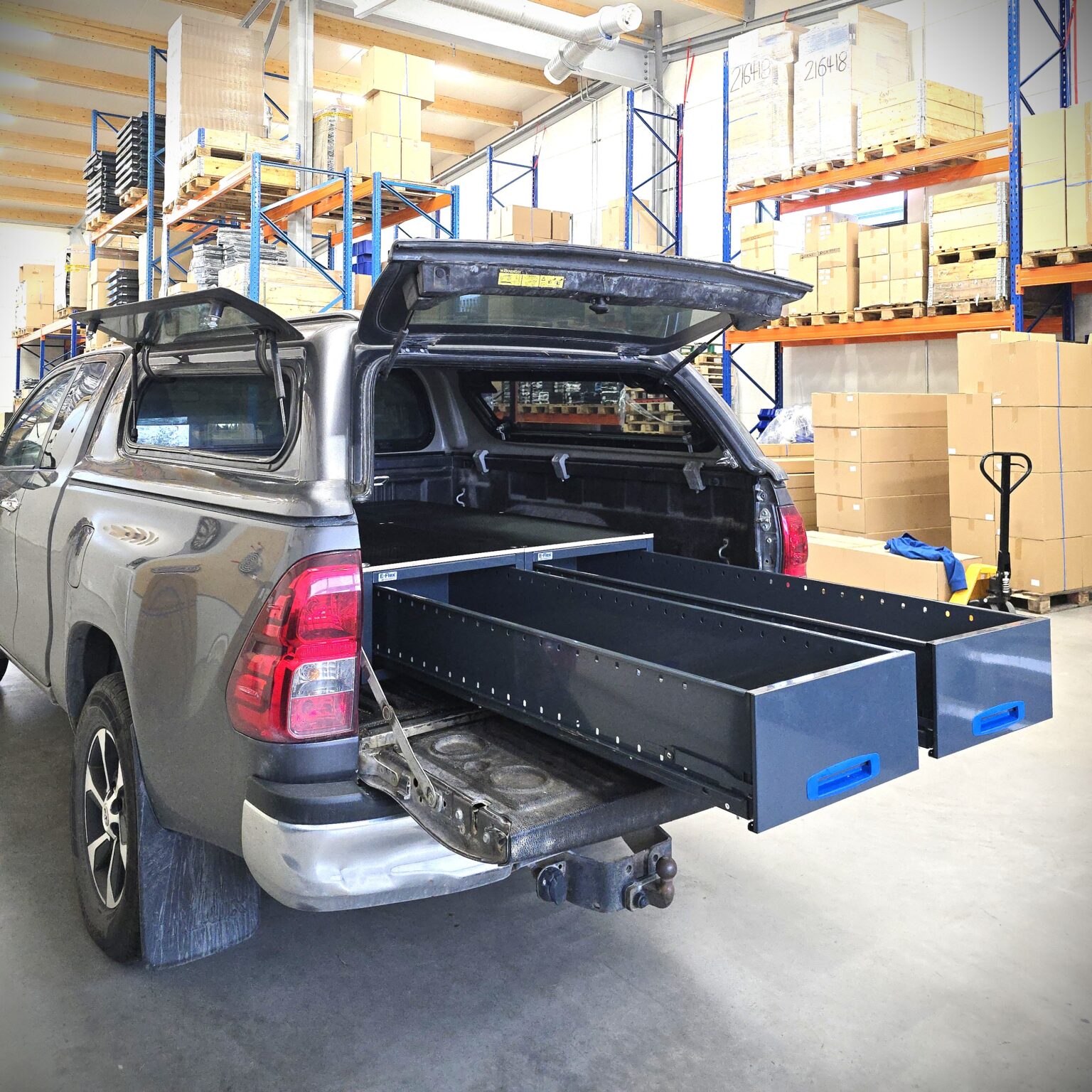 Toyota Hilux Extra Cab with two long drawer units installed in the pickup bed