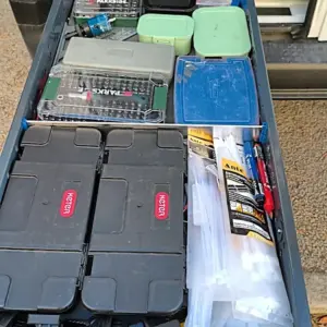 Portuguese customers installing long drawer units in a van and showing organized storage