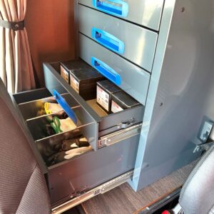 Screw drawer unit installed inside a truck cab for small parts and accessories