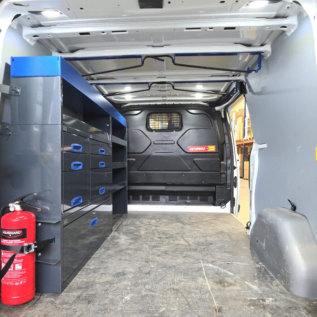 Two ladder racks on roof of Ford Transit Custom van carrying ladders