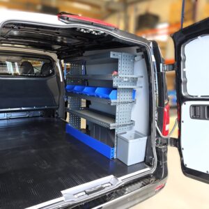 Trash bin integrated into a van shelving unit