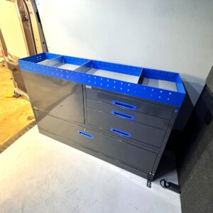 Ford Transit L3 with a 152 cm van shelving unit installed along the left side wall, featuring drawers that pull out through the rear doors.