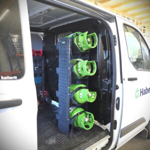 Refrigerant bottle shelf for a van