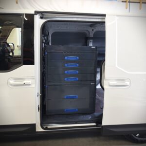 Drawer tower installed by the sliding door of a Kia PV5