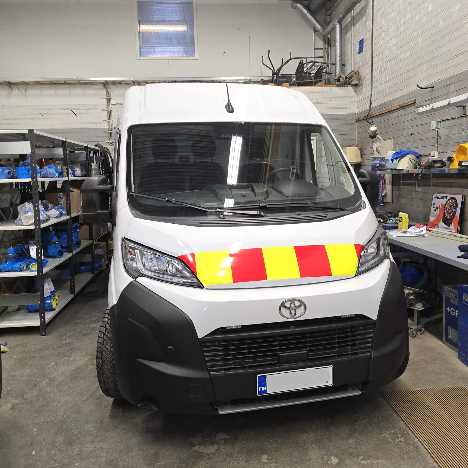 Toyota Proace Max van interior with professional E Flex shelving system on side wall for tools and equipment