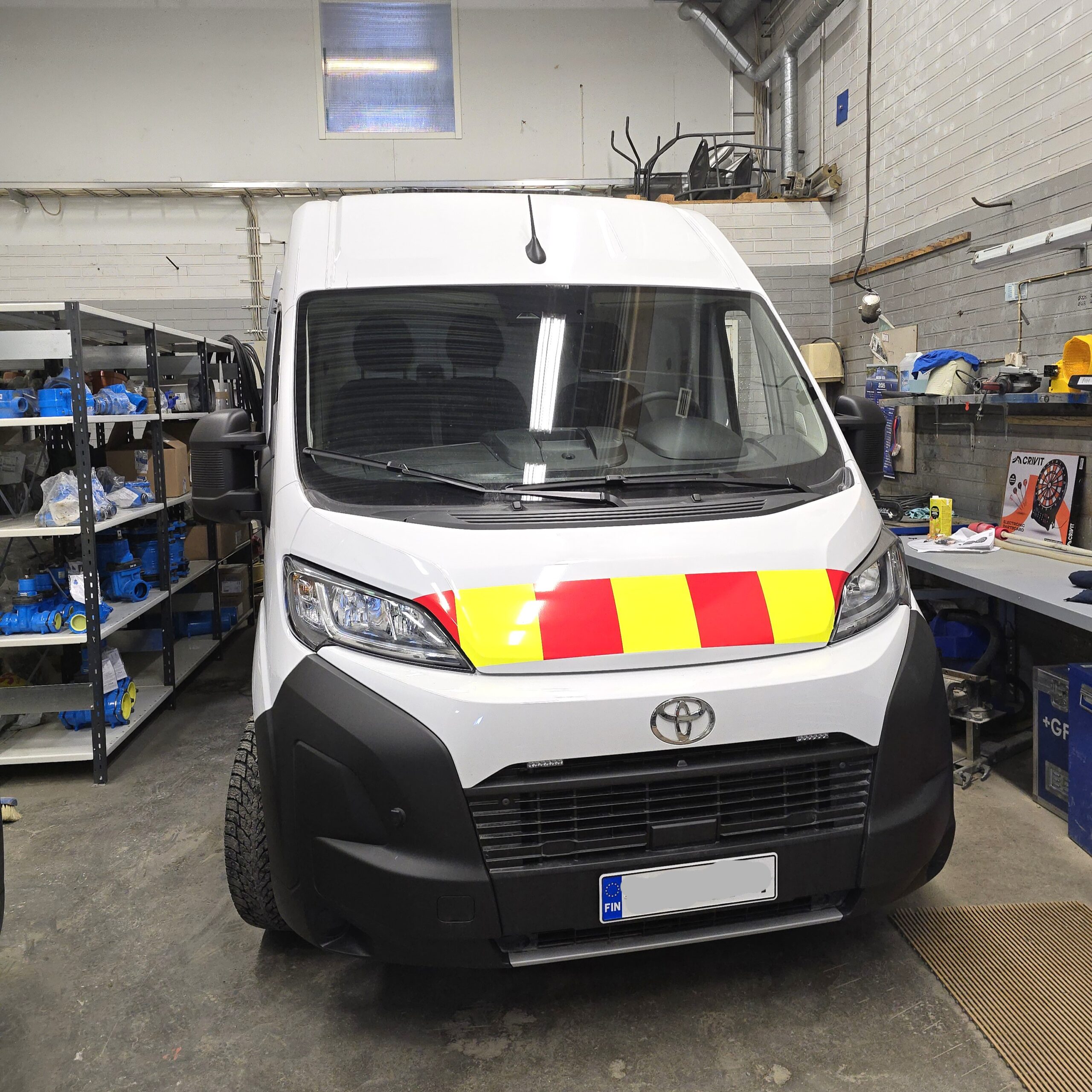 Toyota Proace Max van interior with professional E Flex shelving system on side wall for tools and equipment